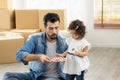 Happy moment family eating chocolate cookie in living room at home. Father and daughter laughing having a good meal in the morning Royalty Free Stock Photo