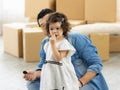 Happy moment family eating chocolate cookie in living room at home. Father and daughter laughing having a good meal in the morning Royalty Free Stock Photo