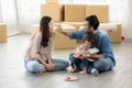 Happy moment family eating chocolate cookie in living room at home. Father Mother and daughter laughing having a good meal in the Royalty Free Stock Photo