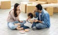 Happy moment family eating chocolate cookie in living room at home. Father Mother and daughter laughing having a good meal in the Royalty Free Stock Photo