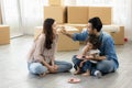 Happy moment family eating chocolate cookie in living room at home. Father Mother and daughter laughing having a good meal in the Royalty Free Stock Photo