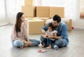 Happy moment family eating chocolate cookie in living room at home. Father Mother and daughter laughing having a good meal in the Royalty Free Stock Photo