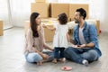 Happy moment family eating chocolate cookie in living room at home. Father Mother and daughter laughing having a good meal in the Royalty Free Stock Photo