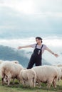 A happy moment of a female farmer and her sheep