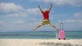 Happy time in summer vacation with young man jumping up on the tropical beach Royalty Free Stock Photo