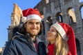 Happy moment of a young lovely couple during their Christmas holiday in Rome. Royalty Free Stock Photo