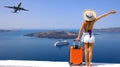 Happy moment with young woman tourist as orange the luggage in Santorini island,Greece Royalty Free Stock Photo