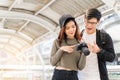 Happy moments. Young Asian couple looking picture on camera Royalty Free Stock Photo