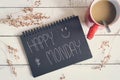 Happy Monday massage on notebook with coffee Royalty Free Stock Photo