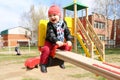 Happy 18 months baby on seesaw outdoors