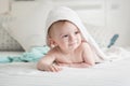 Happy 9 months old baby looking under towel after having bath Royalty Free Stock Photo