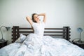 Happy morning of beauty woman streching in bed at home Royalty Free Stock Photo