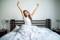 Happy morning of beauty woman streching in bed at home Royalty Free Stock Photo