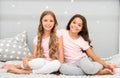 Happy morning. Children in pajamas. Stay at home. Pajamas all day. Cute cozy bedroom for small girls. Sisters having fun Royalty Free Stock Photo