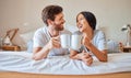 Happy morning, coffee and couple smile in bed feeling relax, love and happiness in a bedroom home. Smiling boyfriend and Royalty Free Stock Photo