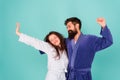 Happy morning. Vacation starting here. Sleepy man and woman happy together. Family traditions. Couple in cozy bathrobes