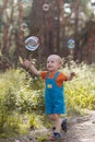 Happy mother baby bubble blower nature concept Royalty Free Stock Photo