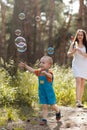 Happy Mother Baby Bubble Blower Nature Concept