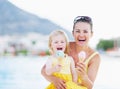 Happy mother and baby eating ice cream Royalty Free Stock Photo