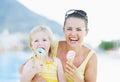 Happy mother and baby eating ice cream Royalty Free Stock Photo