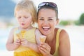 Happy mother and baby eating ice cream Royalty Free Stock Photo