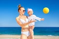 Happy Mother And Baby Girl Playing With Beach Ball. Royalty Free Stock Photo