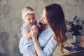 Happy mother and baby playing at home in bedroom Royalty Free Stock Photo