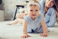 Happy mother and baby playing at home in bedroom Royalty Free Stock Photo