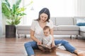 a happy mother with baby reading book Royalty Free Stock Photo