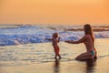 Happy Mother, Baby Son Has Fun In Sea Beach Surf