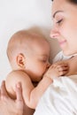 Happy mother breast feeding her baby infant Royalty Free Stock Photo