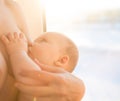 Happy mother breast feeding her baby infant Royalty Free Stock Photo