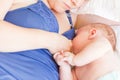 Happy mother breast feeding her baby infant Royalty Free Stock Photo