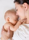 Happy mother breastfeeding her baby infant Royalty Free Stock Photo