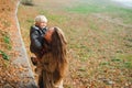 Happy mother and child boy playing and laughing on autumn walk. Young family on autumn walk. Mom and her little son enjoying the Royalty Free Stock Photo