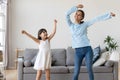 Happy mother and child daughter having fun dancing at home Royalty Free Stock Photo