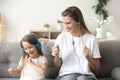 Happy mother and child daughter listening to music in earphones Royalty Free Stock Photo