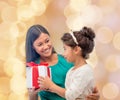 Happy mother and child girl with gift box Royalty Free Stock Photo