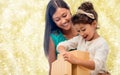 Happy mother and child girl with gift box Royalty Free Stock Photo