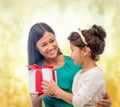 Happy mother and child girl with gift box Royalty Free Stock Photo