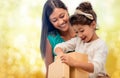 Happy mother and child girl with gift box Royalty Free Stock Photo