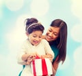 Happy mother and child girl with gift box Royalty Free Stock Photo