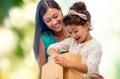 Happy mother and child girl with gift box Royalty Free Stock Photo