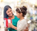 Happy mother and child girl with gift box Royalty Free Stock Photo