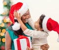 Happy mother and child girl with gift box Royalty Free Stock Photo