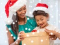Happy mother and child girl with gift box Royalty Free Stock Photo