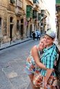 Valletta, Malta, August 2015. Happy mother and child on the old city street.