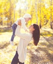 Happy mother and child playing having fun in autumn Royalty Free Stock Photo