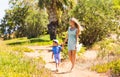 Happy mother with child son having fun outdoors in summer day Royalty Free Stock Photo