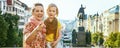 Happy mother and child tourists in Prague pointing in camera Royalty Free Stock Photo